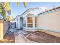 Exterior entrance with large windows, a door with access gate at 8072 Big Top Dr, Las Vegas, NV 89123