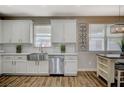 Charming kitchen showcasing white cabinetry, stainless steel appliances, subway tile backsplash and butcher block countertops at 9601 Rolling Thunder Ave, Las Vegas, NV 89148