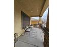 Cozy covered porch with seating area, perfect for relaxing outdoors at 10220 Radcliffe Peak Ave, Las Vegas, NV 89166