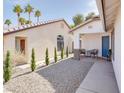 Charming single-story home featuring a rock garden, walking path, and private front courtyard at 1323 Winter Solstice Ave, Henderson, NV 89014