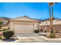 Well-maintained single-story home with desert landscaping, and a two-car garage at 1805 Joy Grove Ave, Henderson, NV 89012