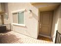 Charming townhouse entrance with a welcoming 'Home Sweet Home' doormat at 2946 Plum Torte St, Las Vegas, NV 89122