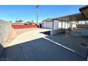 Large backyard with a detached garage and storage shed, great for outdoor activities at 4964 Dunkirk Ave, Las Vegas, NV 89121