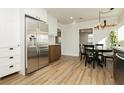 Bright kitchen featuring white cabinets, stainless steel appliances and a dining table at 525 Date St, Boulder City, NV 89005