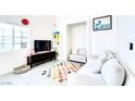 Bright living room featuring neutral decor, large windows, and stylish accents at 5476 Green Horn St, Las Vegas, NV 89118