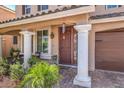 Inviting entrance with decorative metal security door, and attractive brick pavers at 6461 Mount Eden Ave, Las Vegas, NV 89139