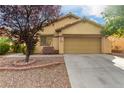 Inviting single-story home featuring a well-maintained front yard and a two-car garage at 8233 Valley Stream Ave, Las Vegas, NV 89131