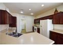 Bright kitchen featuring stainless steel appliances, a breakfast bar, and ample counter space at 8376 Rygate Ave, Las Vegas, NV 89178