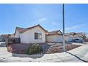 A well-kept single-story home on a corner lot with a tidy, low-maintenance front yard at 1701 Santa Rosalia Dr, North Las Vegas, NV 89031