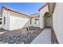 Inviting walkway to the front door with well-kept landscaping and decorative rock features at 1701 Santa Rosalia Dr, North Las Vegas, NV 89031