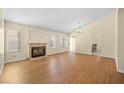 Spacious living room with a cozy fireplace and large windows for natural light at 1701 Santa Rosalia Dr, North Las Vegas, NV 89031