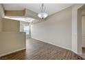 Spacious living room featuring wood floors, neutral paint and modern lighting at 20 E Serene Ave # 304, Las Vegas, NV 89123