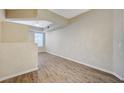 Bright living room featuring wood flooring, neutral paint, and a ceiling fan at 20 Serene Ave # 201, Las Vegas, NV 89123