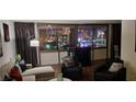 Comfortable living room with modern furnishings and a stunning city view through large windows at 205 E Harmon Ave # 704, Las Vegas, NV 89169