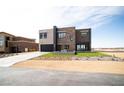 Contemporary home with a combination of textures and a unique water feature at 3530 S Spring Mountain Blvd Ct, Pahrump, NV 89048