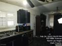 Functional kitchen featuring classic dark cabinetry, a stainless steel sink, and ample countertop space at 421 Miller Ave, North Las Vegas, NV 89030
