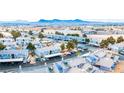 Wide angle aerial of a condo community featuring matching buildings, mature trees, and desert landscape at 5340 Silvermist Ct # 202, Las Vegas, NV 89122