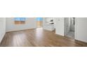 Bright and open living space featuring hardwood floors and access to the kitchen at 637 N Water St, Henderson, NV 89015