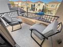 Private balcony with comfortable seating, perfect for enjoying the outdoors and neighborhood views at 9137 Entrancing Ave, Las Vegas, NV 89149