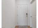 Clean white six-panel front door with digital lock at 1410 Pink Dawn Dr, Henderson, NV 89014