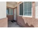 Welcoming front porch with decorative mat and stylish exterior paint at 1410 Pink Dawn Dr, Henderson, NV 89014
