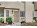 A home's exterior shows a secure screen door entrance and well-kept landscaping at 2641 Ruthe Duarte Ave, Las Vegas, NV 89121