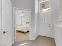 Inviting foyer showcasing the front door, tile flooring, and a glimpse into the bedroom at 3425 Conan St # 103, Las Vegas, NV 89129