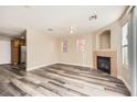 A large living room provides ample space and features modern plank floors and neutral paint at 4052 Rocky Beach Dr, Las Vegas, NV 89115