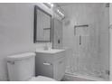 Modern bathroom featuring glass shower with stylish tiling and updated vanity at 501 National St, Henderson, NV 89015