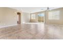Open floor plan featuring tile flooring and sliding glass door at 5648 Alitak Bay St, North Las Vegas, NV 89081