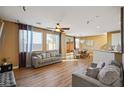 Bright and spacious living room with hardwood floors and open concept design with contemporary furniture at 6121 Sinatra Sands Ct, Las Vegas, NV 89130