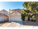 Charming two-story home featuring a well-maintained front yard and a two car garage at 8217 Maplestar Rd, Las Vegas, NV 89128