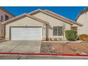 Single story home with neutral stucco, tile roof, rock landscaping, and a two car garage at 8728 Honey Vine Ave, Las Vegas, NV 89143