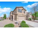 Charming two-story home with a two-car garage, complemented by well-maintained landscaping and a cozy front porch at 108 Fiery Hill Ave, Henderson, NV 89011