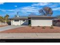 Charming single story home with desert landscaping, neutral exterior paint and driveway at 2605 Amarillo St, Las Vegas, NV 89102