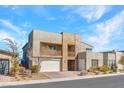 Beautiful exterior of modern home showcasing two-story design and desert landscaping at 3004 Barrett Springs Ave, Henderson, NV 89044
