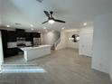 Open concept living room next to kitchen, featuring lots of space and natural light at 3669 Canis Minor Ln # 15101, Henderson, NV 89052