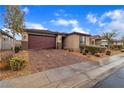 Charming single-story home featuring a brick driveway and a two-car garage at 5716 Alitak Bay St, North Las Vegas, NV 89081