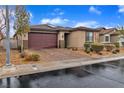 Charming single-story home featuring a brick driveway and a two-car garage at 5716 Alitak Bay St, North Las Vegas, NV 89081