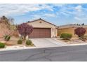 Attractive one-story home with a two-car garage and low-maintenance front yard at 5928 Radiance Park St, North Las Vegas, NV 89081