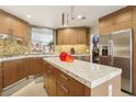 Modern kitchen featuring stainless steel appliances, custom cabinets, and granite countertops at 7315 Mission Hills Dr, Las Vegas, NV 89113