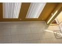 Sunlit entryway features tile flooring and modern window treatments at 8003 Retriever Ave, Las Vegas, NV 89147