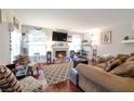 Cozy living room featuring a fireplace and hardwood floors at 8440 Wandering Sun Ave, Las Vegas, NV 89129