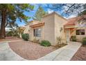 View of charming condo featuring desert landscaping, stucco exterior and tiled roofing at 2851 S Valley View Blvd # 1079, Las Vegas, NV 89102