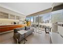 Open-concept living area with modern kitchen, comfortable seating, and expansive windows offering city views at 3726 Las Vegas Blvd # 303, Las Vegas, NV 89158