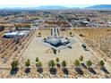 Wide aerial view of the estate, showcasing the landscaping, vineyards, and surrounding neighborhood at 3780 E Kellogg Rd, Pahrump, NV 89061