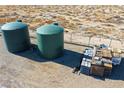 Exterior view of the green water tanks at 3780 E Kellogg Rd, Pahrump, NV 89061
