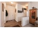 Welcoming entryway with wood floors, decorative accents, and a view of the living space at 425 Golden State St, Henderson, NV 89012