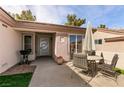 Inviting patio area with table, chairs, and shade umbrella at 425 Golden State St, Henderson, NV 89012