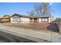 Charming single-story home featuring a low fence and drought resistant landscaping at 4404 Montebello Ave, Las Vegas, NV 89110